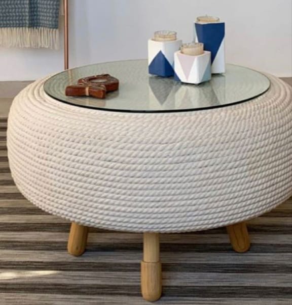Tyre Ottoman with Hessian rope,pine legs and glass top . Height 36cm, width 57 cm